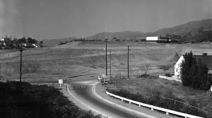 Playground Construction. In the upper left sits the Eagle Rock Recreation Center Clubhouse, designed by architect Richard Neutra. Modernist landscape designer Garrett Ekbo, who often worked with Neutra, designed the landscape for this difficult site. This 1959 photograph shows the substantial grading needed to adopt the site for picnic and play areas. The road in the foreground connects Figueroa Street to the old highway bridge behind us. (Photograph by Joe Friezer.)