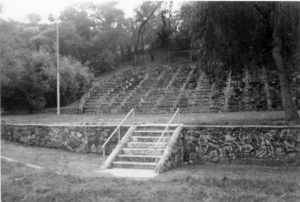 Considerable graffiti damage is evident here together with the removal of the original wooden seating in the audience. The masonry is almost strong enough to outshine the graffiti.-Photo Eric warren, 2001.