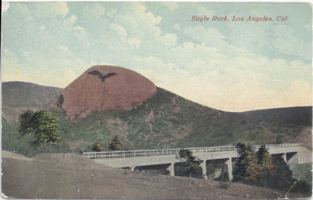 This postcard shows the bridge built to further the connection of the San Fernando Valley through Eagle rock to the San Gabriel Valley via State Highway 134. The route ran up what is now Eagle Vista Avenue and crosser the valley about where the freeway crosses now. The Arroyo Seco Bridge completed this connection in 1913. (ERVHS)