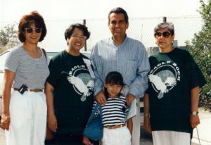 Angie Alatorre; Eagle Rock Field Deputy, Ruby de Vera; 14th District Councilmember Richard Alatorre, holding Melinda Ramos; and Highland Park Field Deputy Juanita Martinez, hosted the dedication ceremony at the base of the Rock in 1996. Finally the icon for which the community was named was publicly owned and would be preserved from inappropriate development. After the ceremony, a community fair, car show and concert were held at the recreation center. (John Miller Photograph-ERVHS)