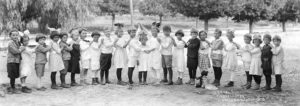 Eagle Rock adopted kindergarten (a new concept at the time) in 1915. Miss Walker found 30 children under 5 ½ years of age, out of a population that had not reached 1000. Pictured is the kindergarten class of 1918. -Elena Frackelton Murdock family.