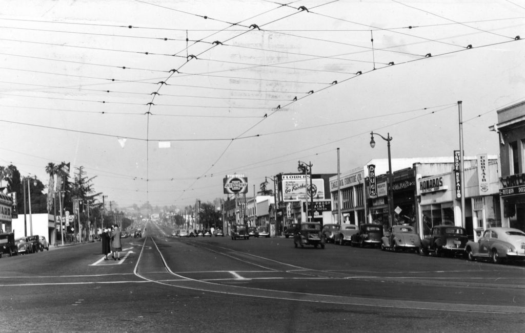 6.	The intersection of Colorado Boulevard looking east from Eagle Rock Boulevard. The passenger boarding area is shown to the left of the tracks. The sign for Wynn’s Chevrolet dealership is in the center of the photograph. (Southern California Railway Museum, Statsdust photograph)