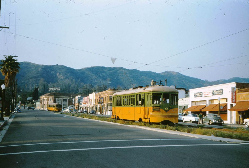On the last day of its run, May 21, 1955, the streetcar passes the Serv-Well Market. The Wong family, who owned the business, also owned a home in Eagle Rock. This was unique due to the systematic exclusion of Asians from housing at the time. (Alan Weeks photograph)