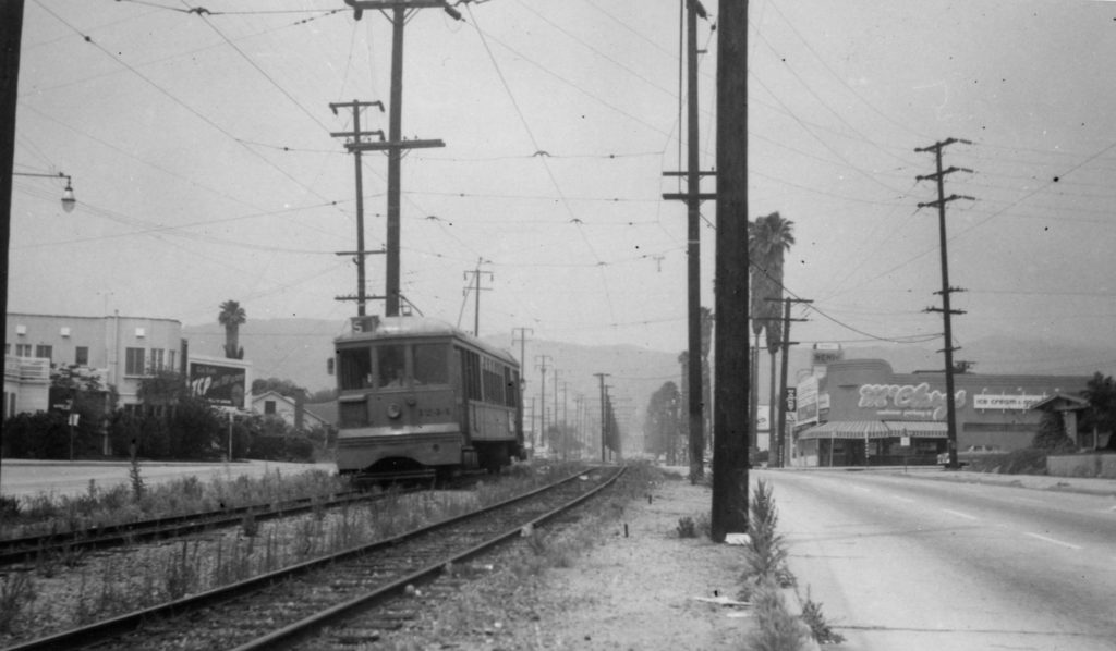 Stopped at Westdale. The boulevard narrows at this point as we pass into the area of Eagle Rock City. The buildings to the left and right still stand. (Southern California Railway Museum, Ray Younghans photograph)