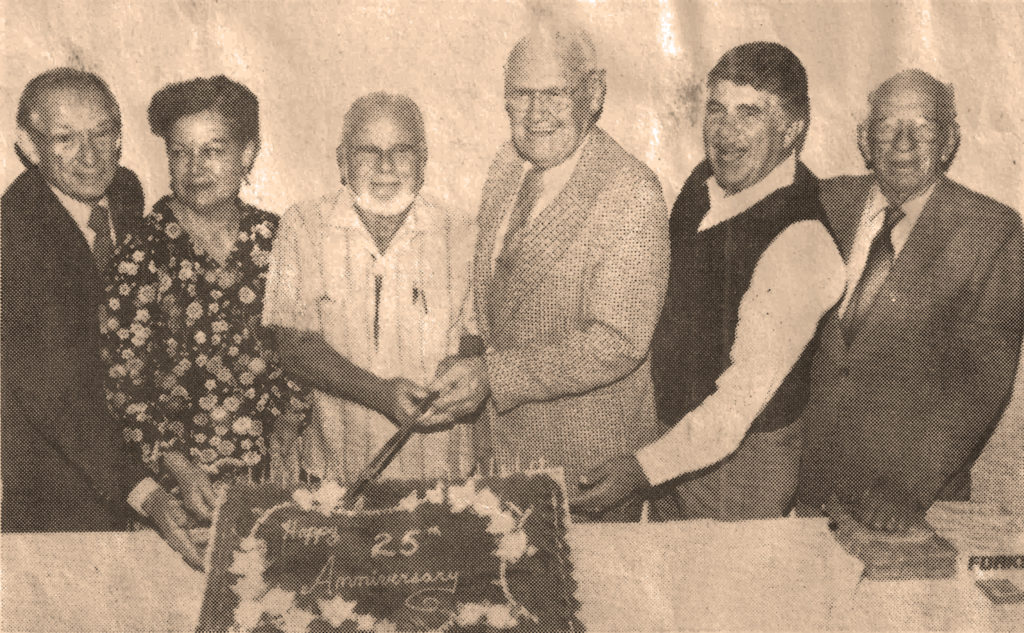 All of the then-past presidents of the society gather here to cut the cake at the 25th anniversary celebration. Pictured are from left, Joe Northrup, 1969-73; Lois Woods, 1979-81; Henry Welcome, 1961-65 and 1981-83;Walter Dickey, then current president; Powell Greenland, 1965-69; and Ralph Sherman, 1973-77. (Photograph by Joe Friezer, published in the Eagle Rock Sentinel.)