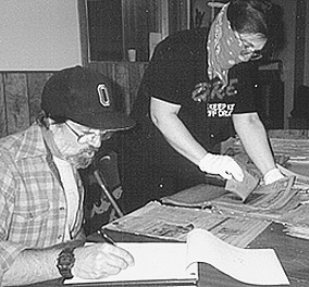 John de la Fontaine and Mary Andrews sorting the Eagle Rock Advertiser, our second archival project after reestablishing ourselves downstairs in the Cultural Center. (Melody Peterson-ERVHS)